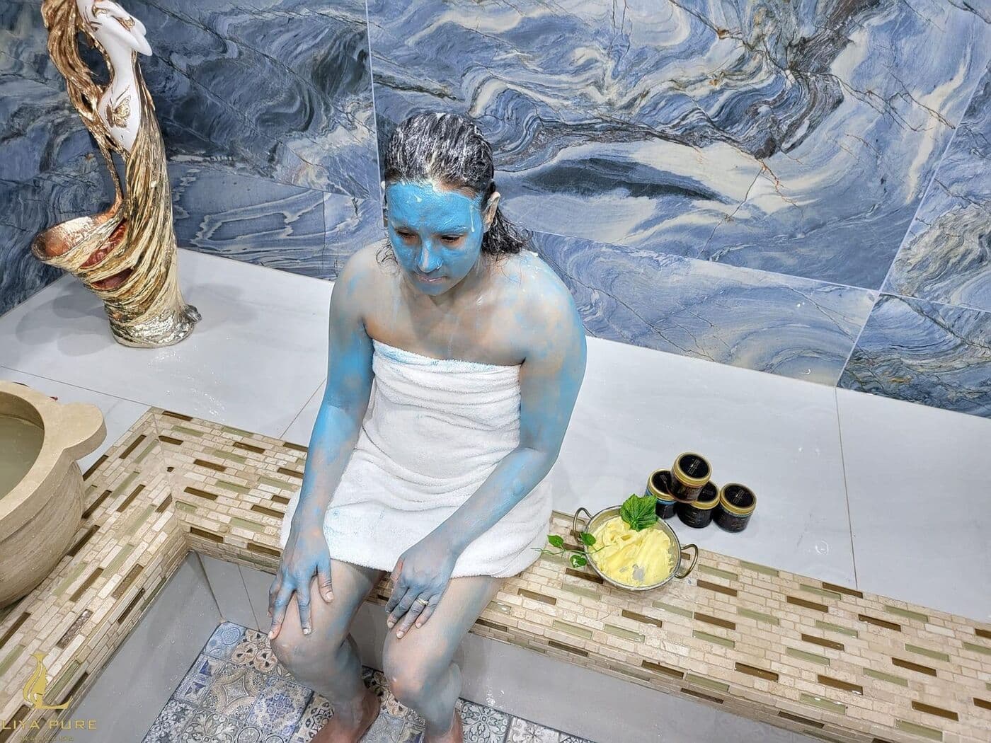 Guest relaxing on a hammam bed